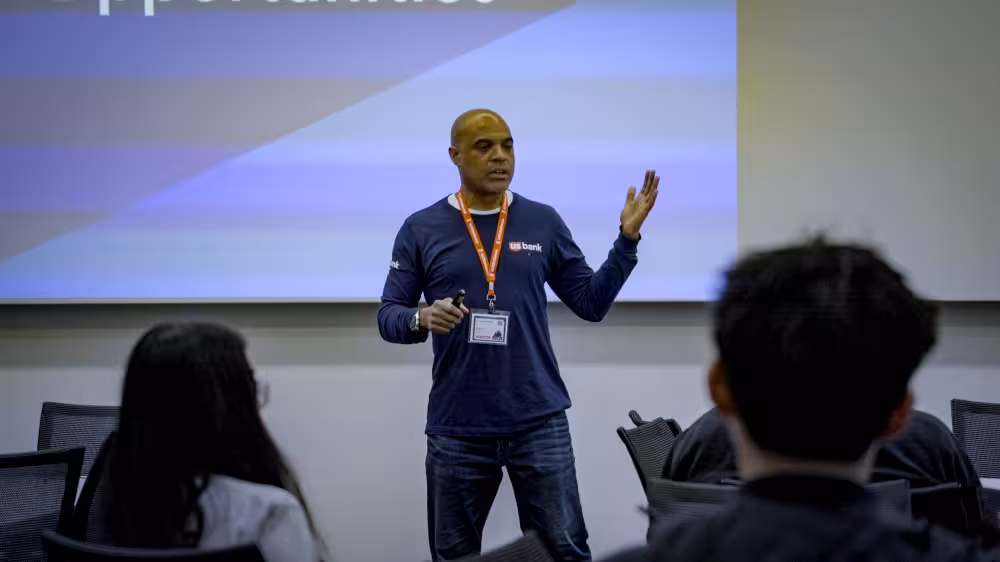 An image of a speaker presenting at TechOlympics 2025: Inspire.